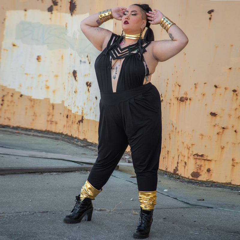 Plus Size Dark Fashion on Kitty Kapow standing in an industrial setting.